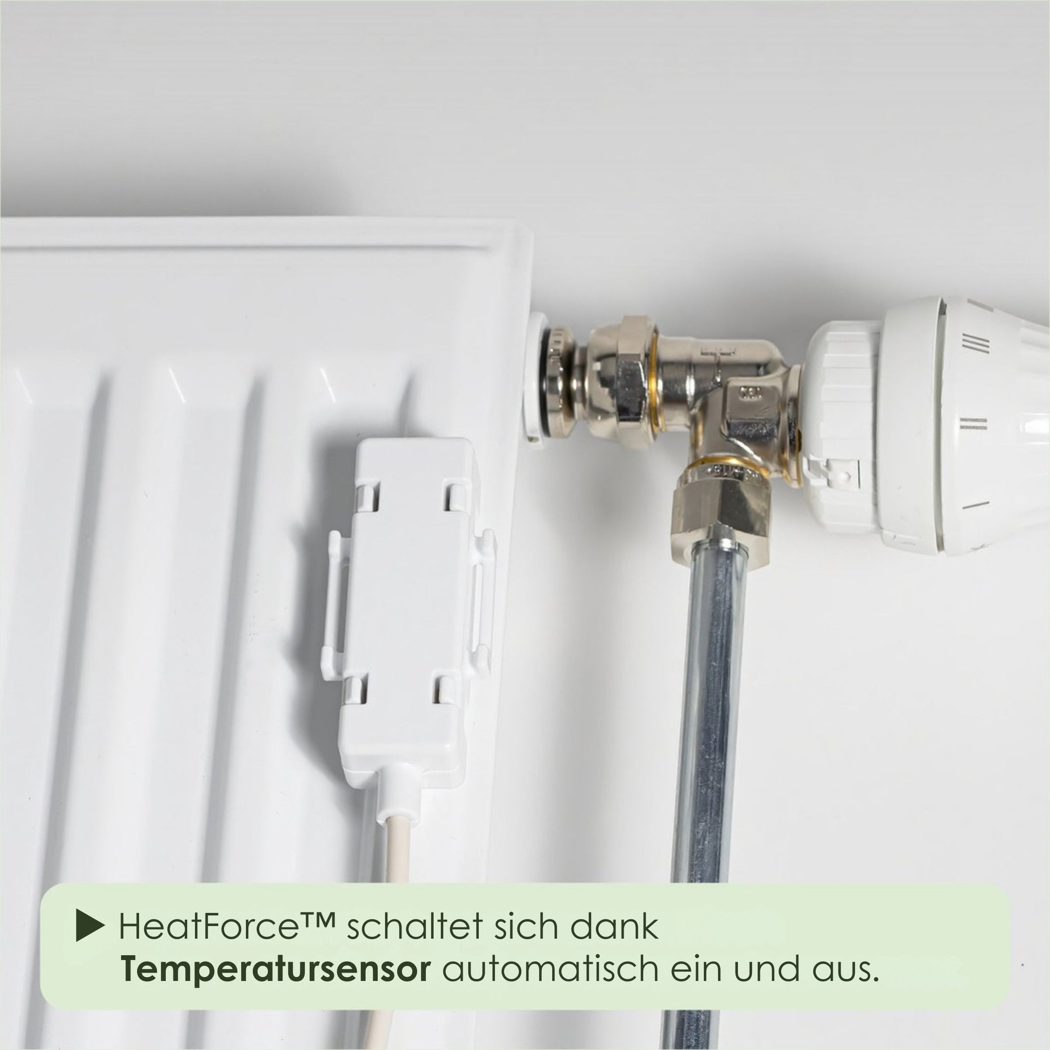 Close-up of a radiator with a temperature sensor and 'HeatForce' label on a white background.